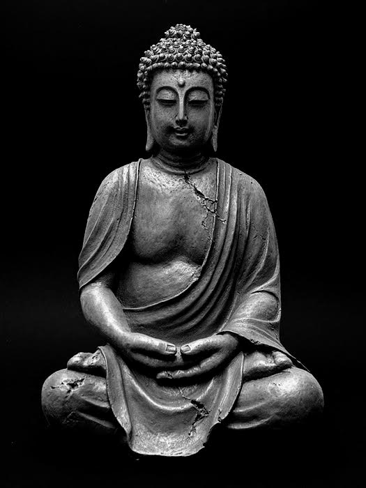 Statue of Buddha, seated, dhyana mudra, in black and white.